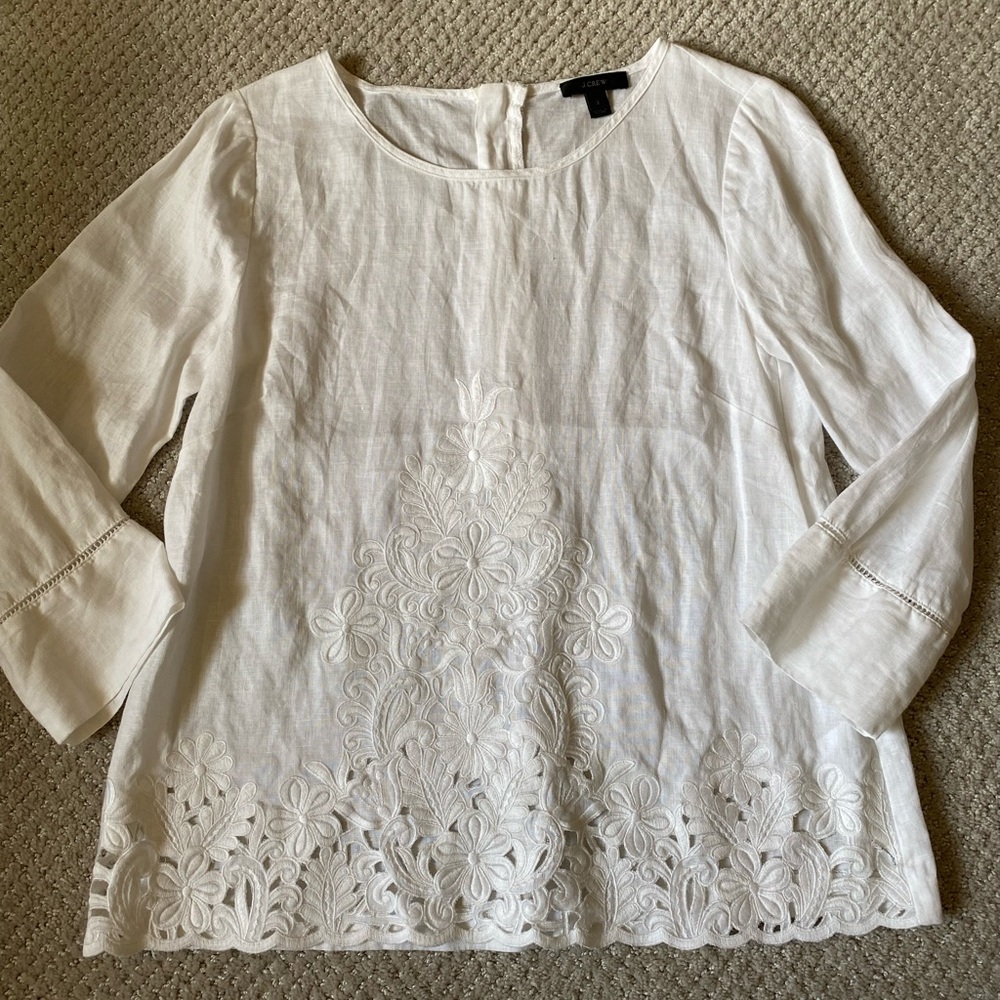 Women’s J. Crew blouse with floral detailing.